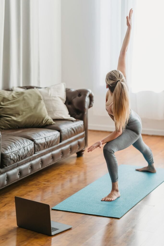 Woman practicing yoga at home