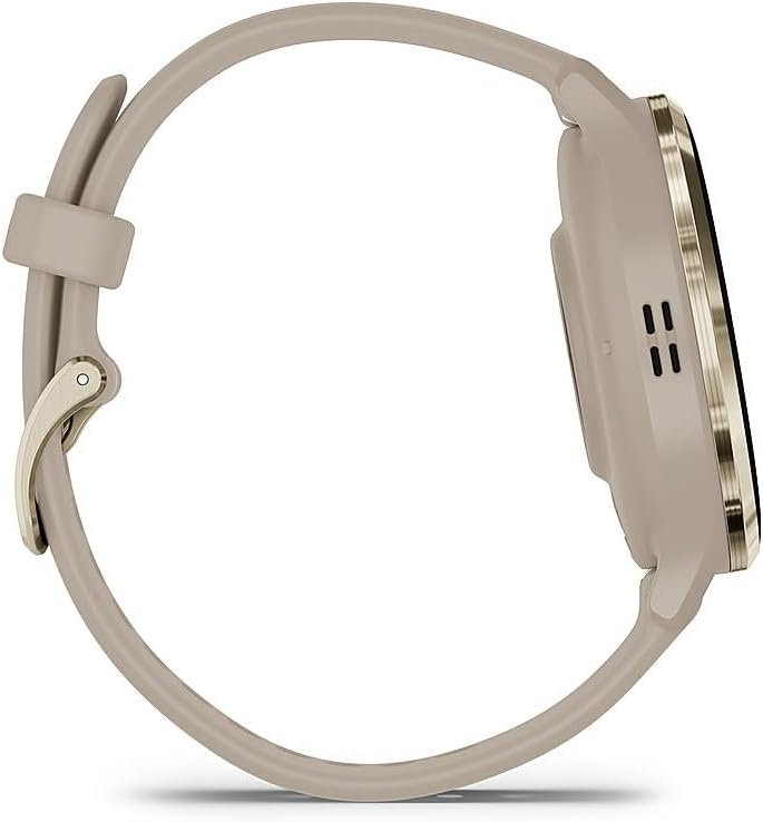 A close-up of the Garmin Venu 3S smartwatch with a gold steel bezel and French gray case, displaying a heart rate reading on its bright, colorful screen, worn on a wrist.