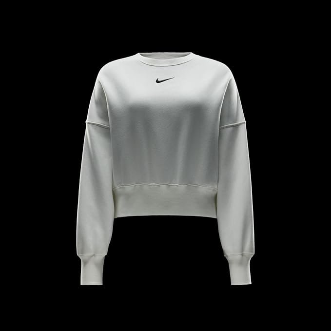 Nike Women's Phoenix Oversized Crewneck Sweatshirt – Soft Fleece, Casual & Trendy for Daily Wear A woman wearing the Nike Sportswear Phoenix Fleece oversized crewneck in Sail/Black, paired with leggings, standing in a relaxed pose that highlights the dropped shoulder seams and relaxed fit.