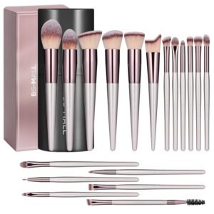 A complete set of BS-MALL pink makeup brushes is laid out on a white marble surface, showcasing the variety of foundation, eyeshadow, and blending brushes included in the kit.