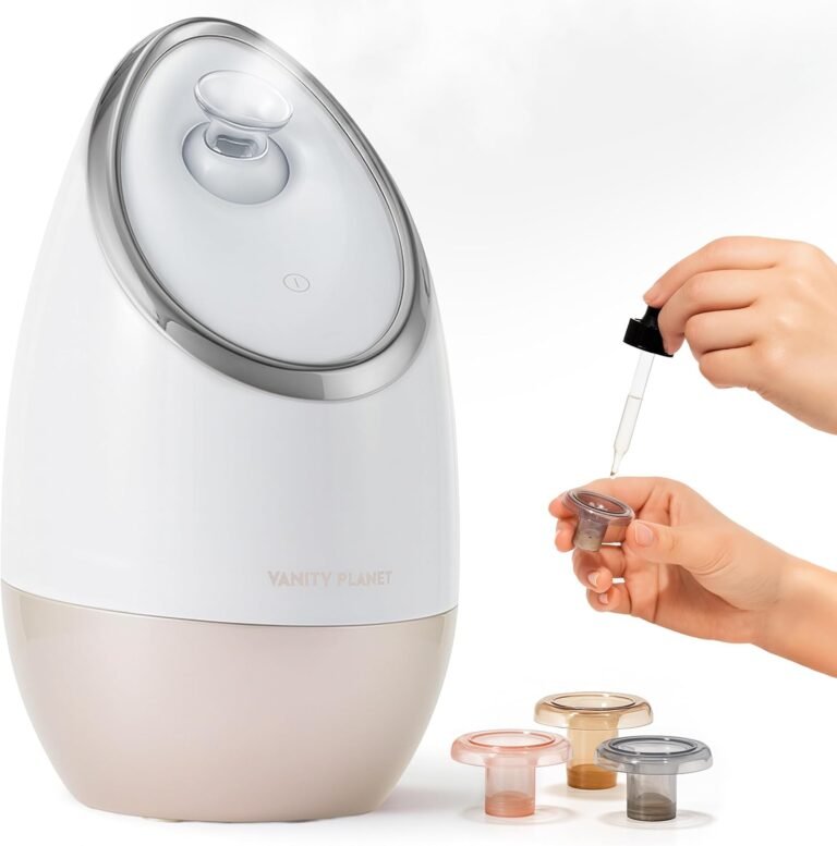 Best Facial Steamer for Deep Cleaning (At-Home Spa Guide 2026) A soft-beige Vanity Planet Aira Ionic Facial Steamer on a clean countertop, with a gentle mist rising from the adjustable nozzle, surrounded by a towel and skincare products.
