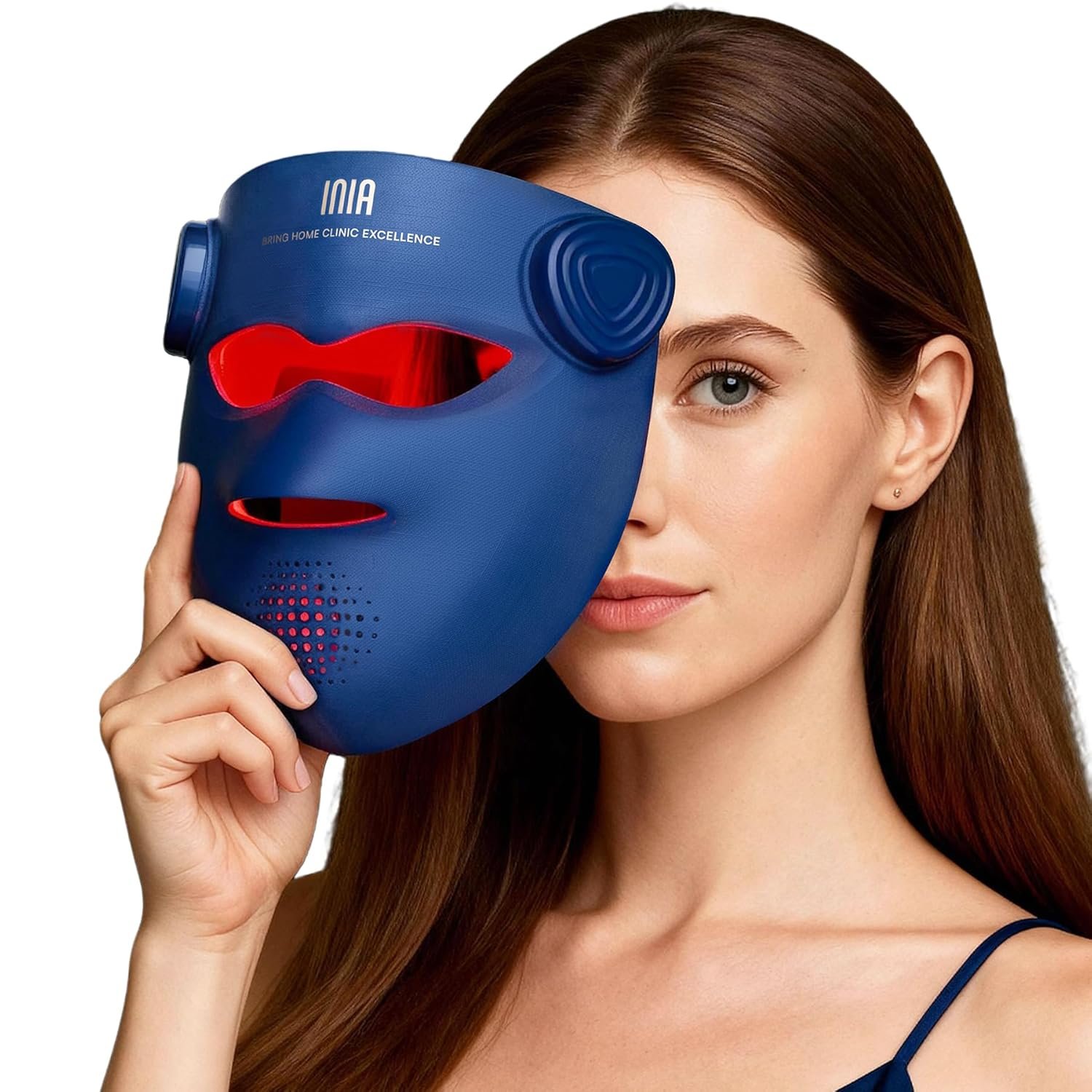 A woman holding INIA LED light therapy face mask with red light for facial skin treatment