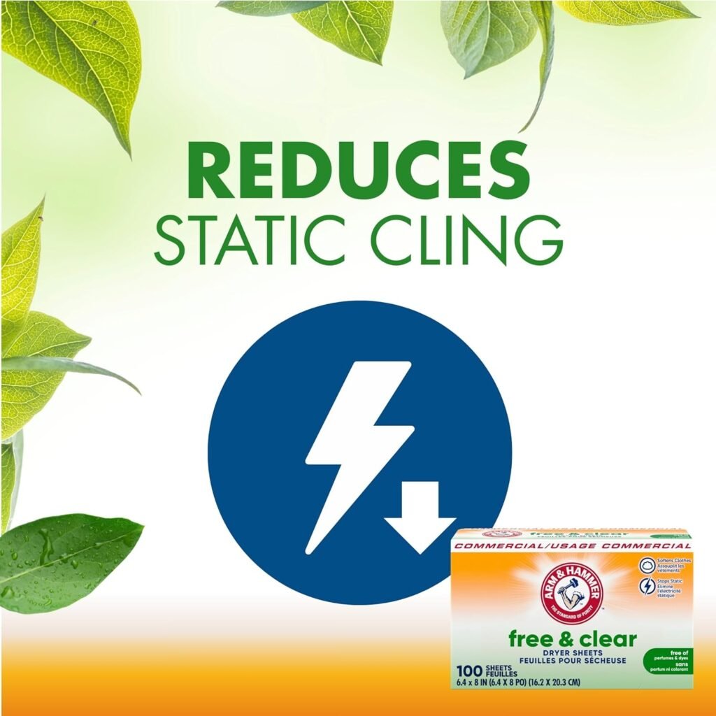 A box of Arm & Hammer Free & Clear Dryer Sheets is open on a clean laundry counter, with a single sheet draped over freshly folded white towels.
