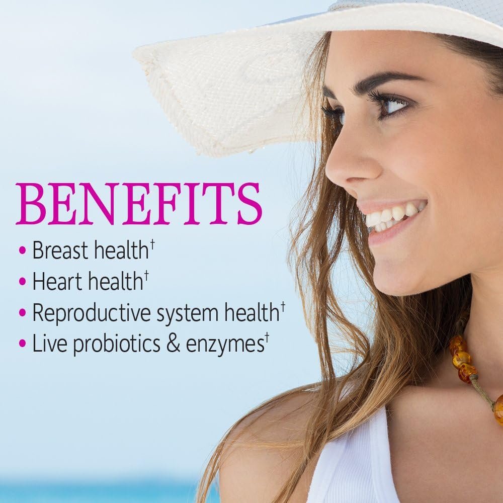 A bottle of Garden of Life Vitamin Code Women multivitamin capsules placed next to fresh organic fruits and vegetables like spinach, berries, and apples on a wooden surface.