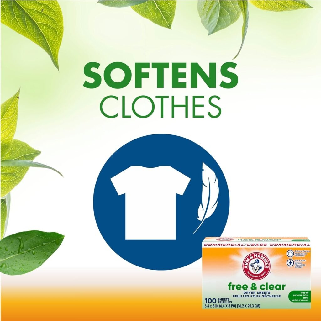 A box of Arm & Hammer Free & Clear Dryer Sheets is open on a clean laundry counter, with a single sheet draped over freshly folded white towels.
