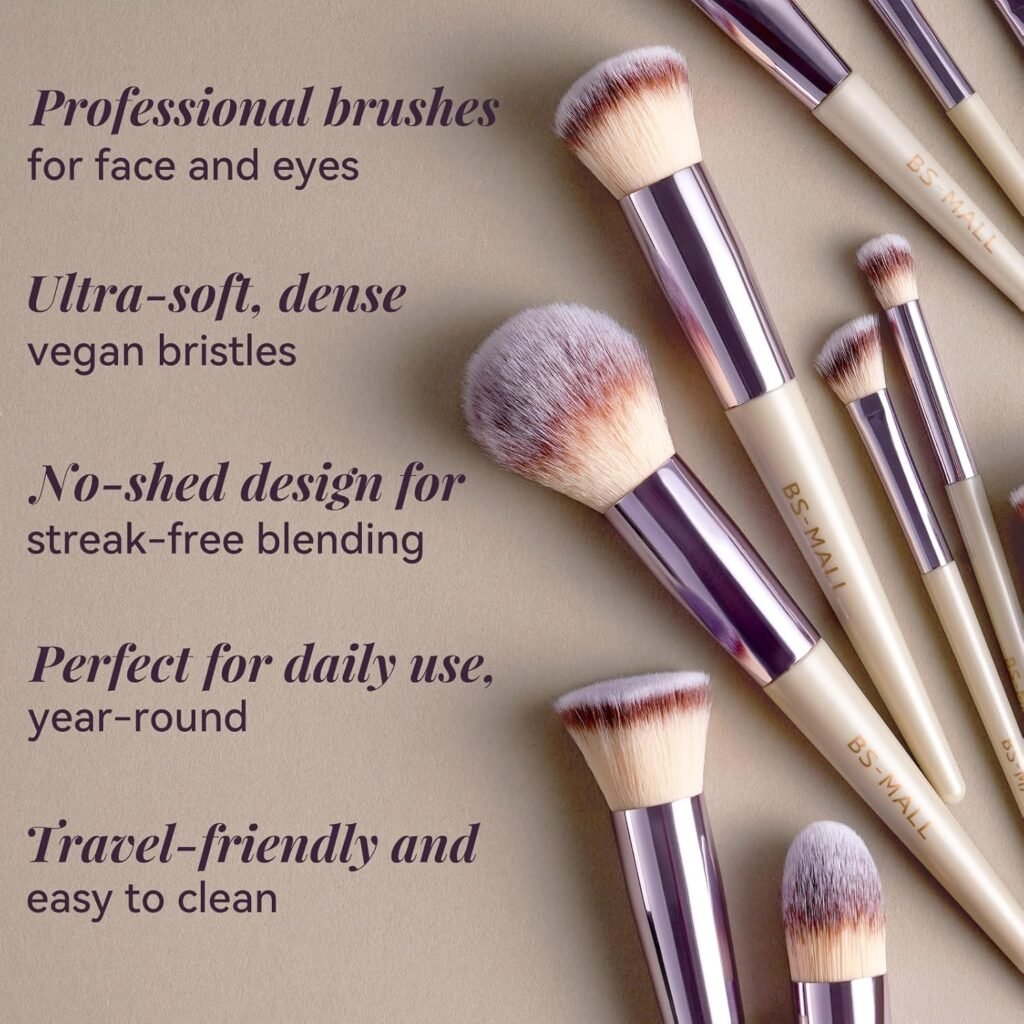 A complete set of BS-MALL pink makeup brushes is laid out on a white marble surface, showcasing the variety of foundation, eyeshadow, and blending brushes included in the kit.