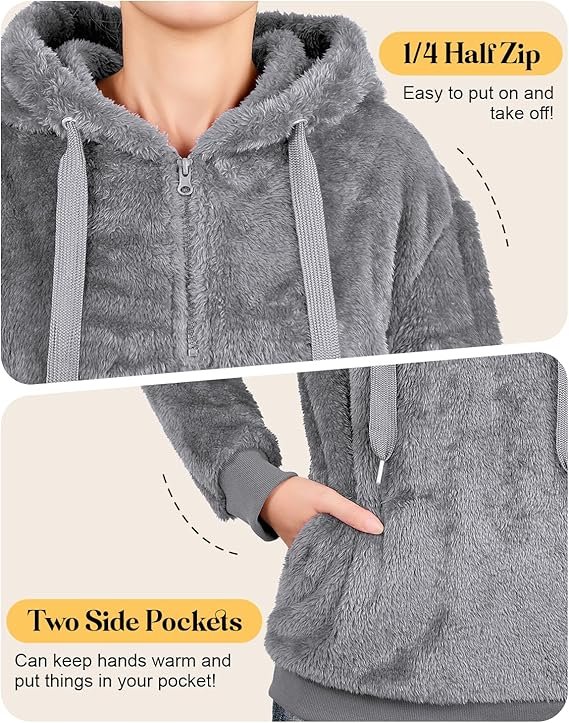 Century Star Fuzzy Hoodie Review 2026: The Ultimate Cozy Oversized Sweatshirt? A woman wearing a soft, oversized gray fuzzy hoodie with a quarter-zip closure, sitting comfortably on a couch with a warm drink, embodying relaxation and comfort.